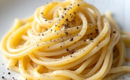 Plate of Cacio e Pepe pasta, showing creamy sauce and black pepper